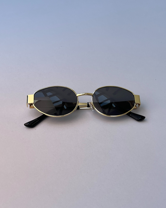Black Oval Sunglasses – Sleek Golden Frame for Women