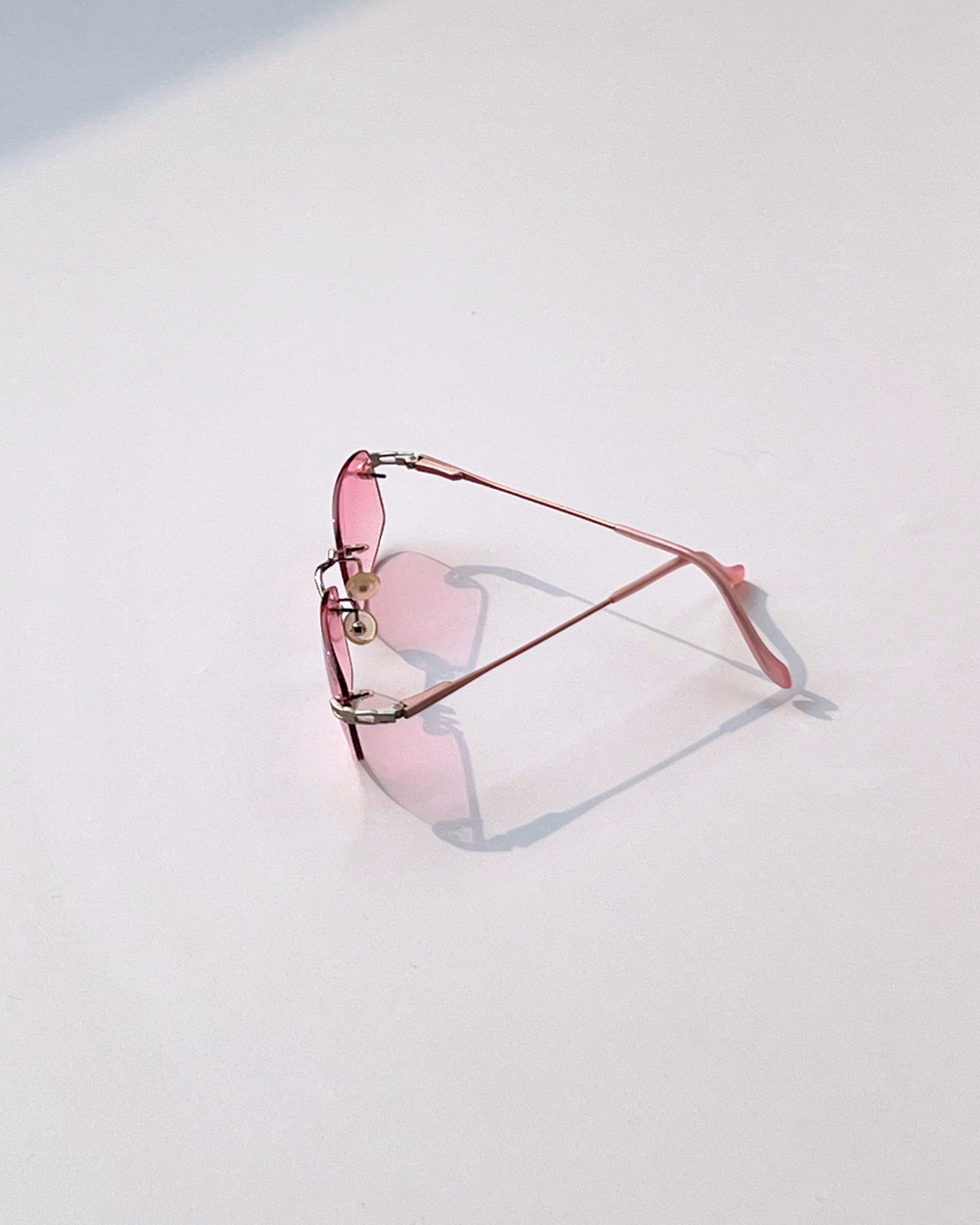Rimless Sunglasses for Women – Soft Pink Lenses