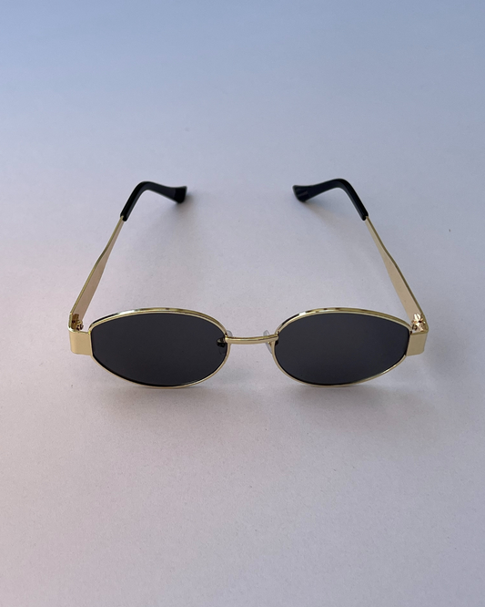 Black Oval Sunglasses – Sleek Golden Frame for Women